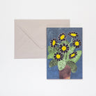 Greeting card with floral design and envelope on a white background