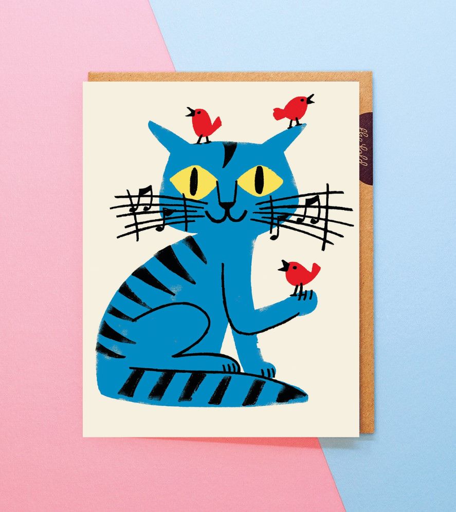 Card with a blue cat illustration and red birds on a pink and blue background