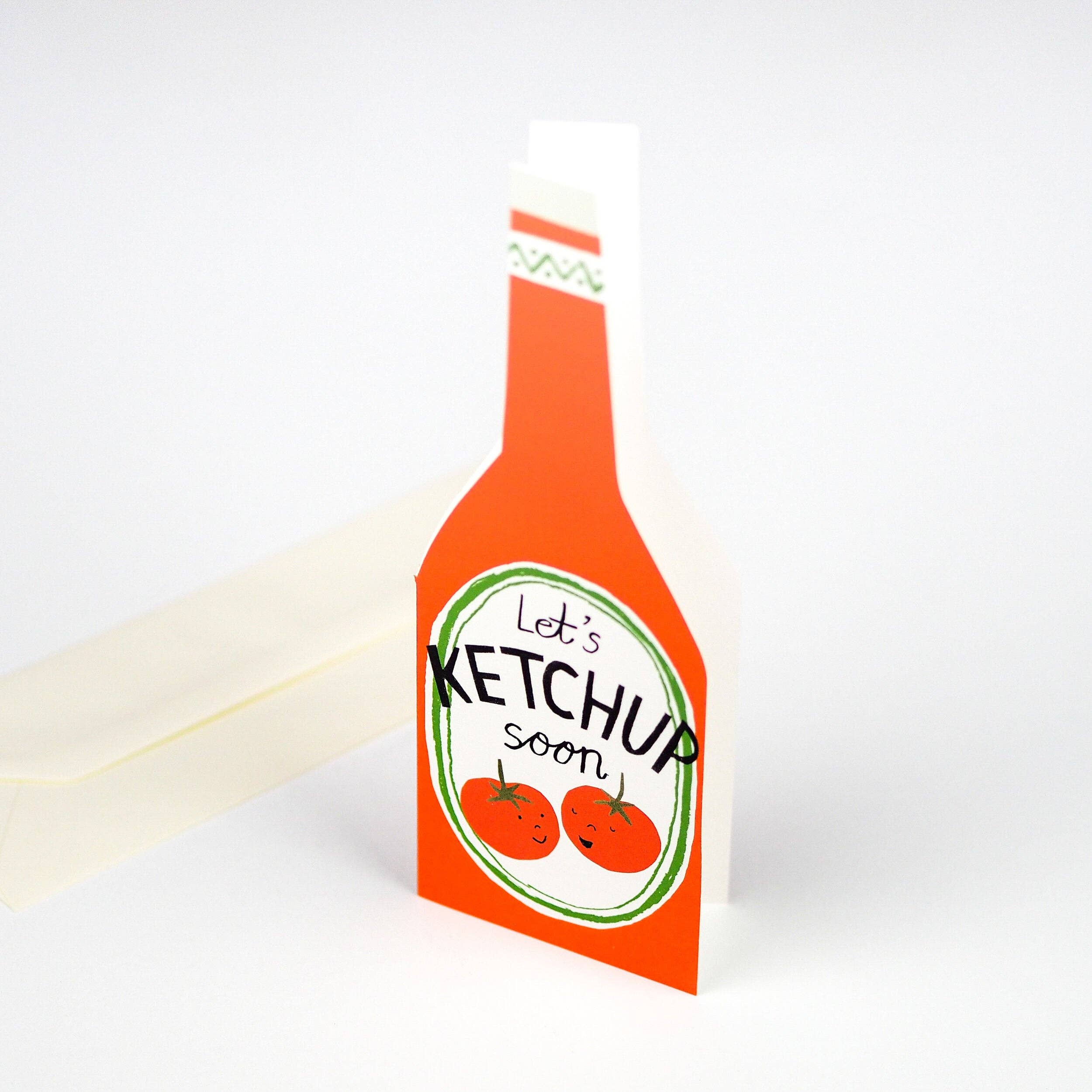 Ketchup bottle-shaped card with 'Let's Ketchup soon' text on a white background