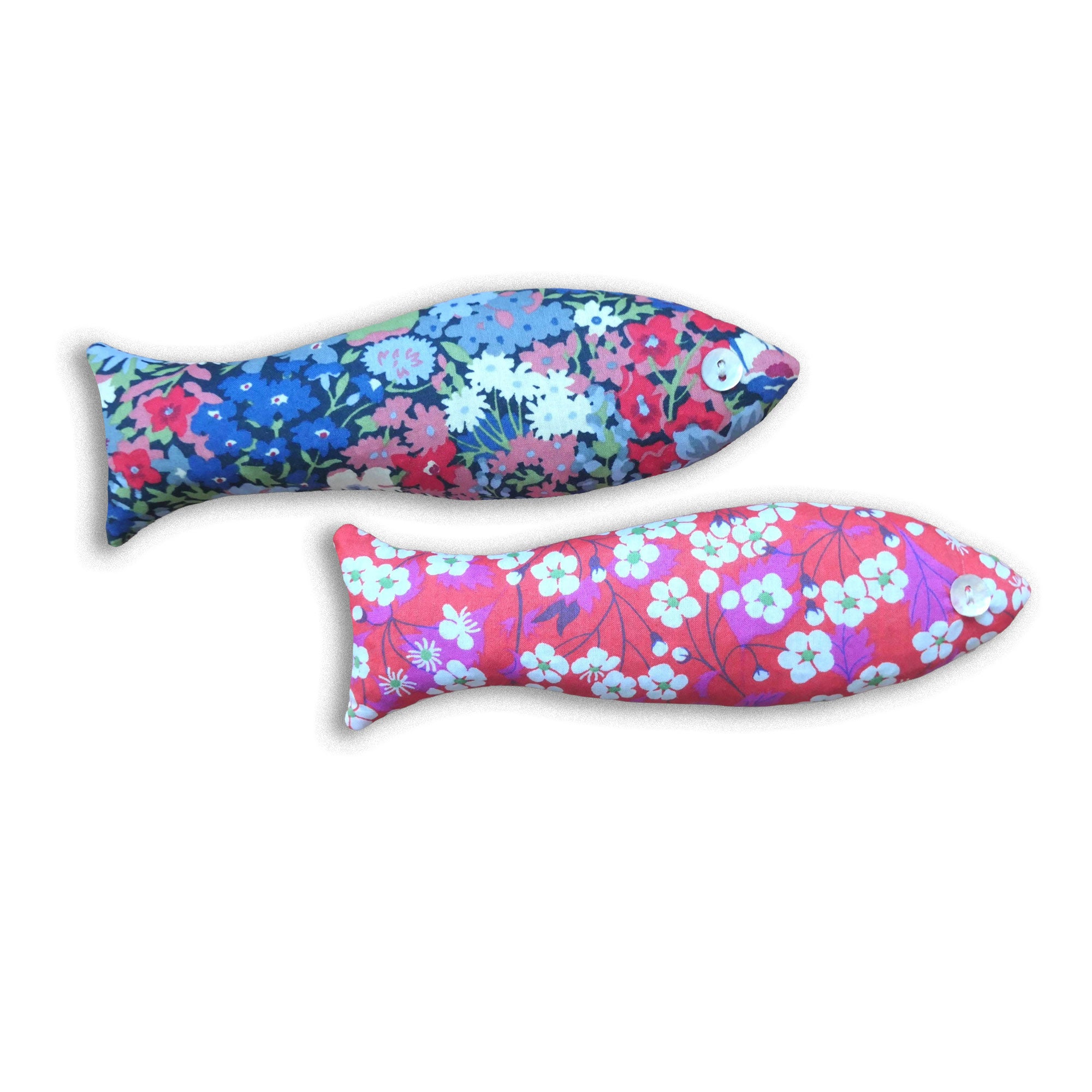 Two floral-patterned fish-shaped sachets in floral prints on a white background