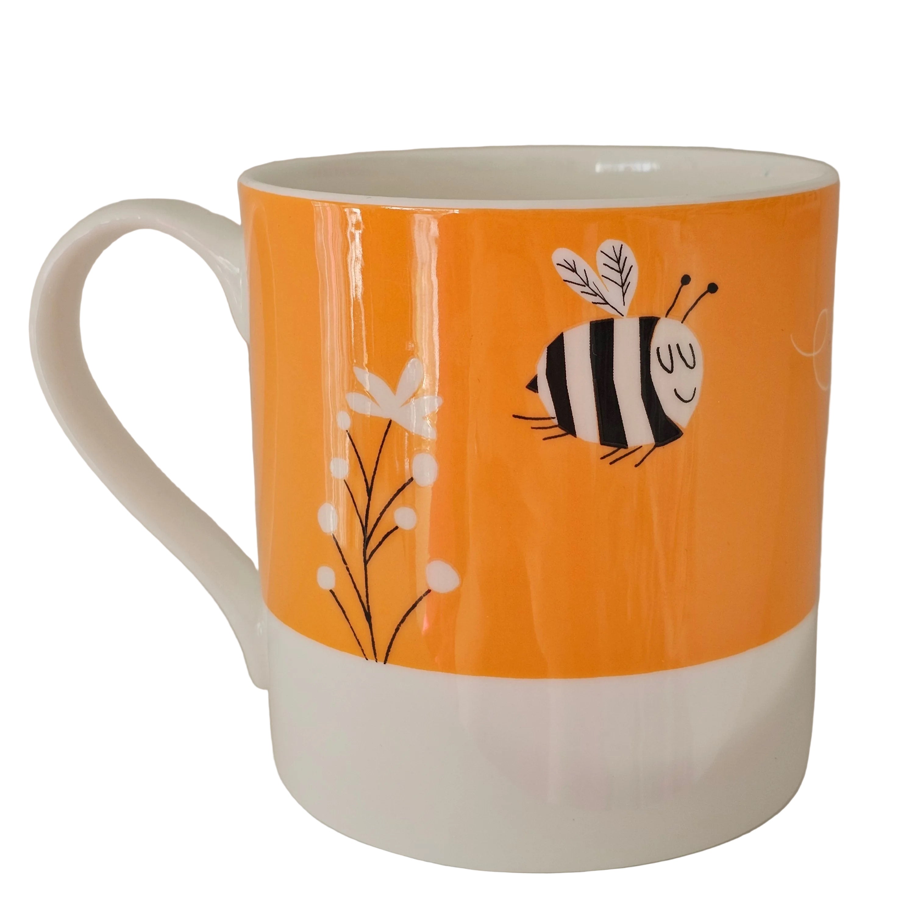 White mug with an orange background featuring a bee design