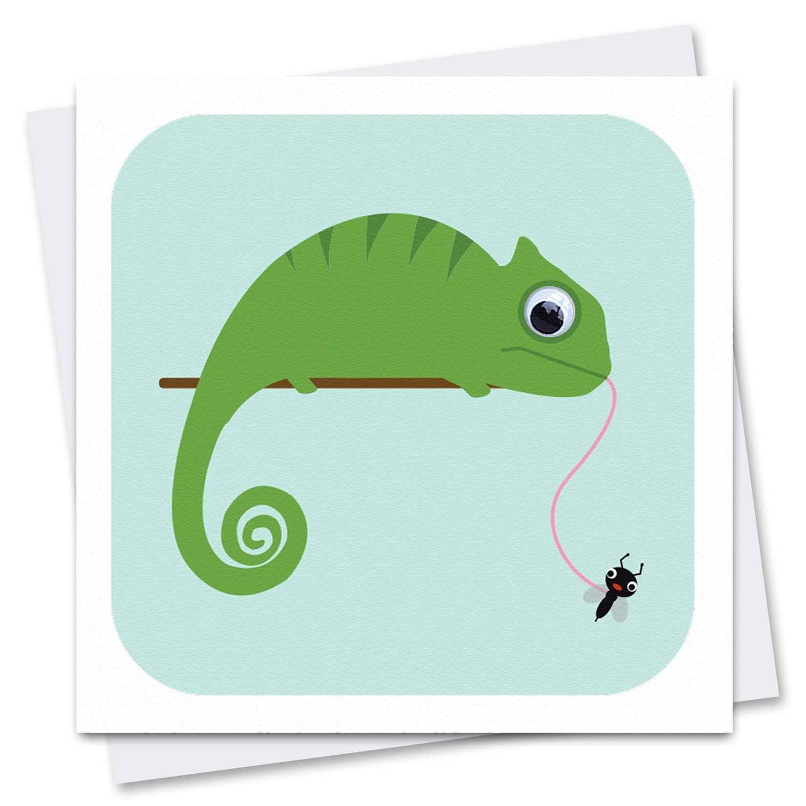 Greetings card featuring a green chameleon with a googly eye, catching an amusing fly with his long pink tongue. Illustration has blue background and a white border. Shown with an envelope.