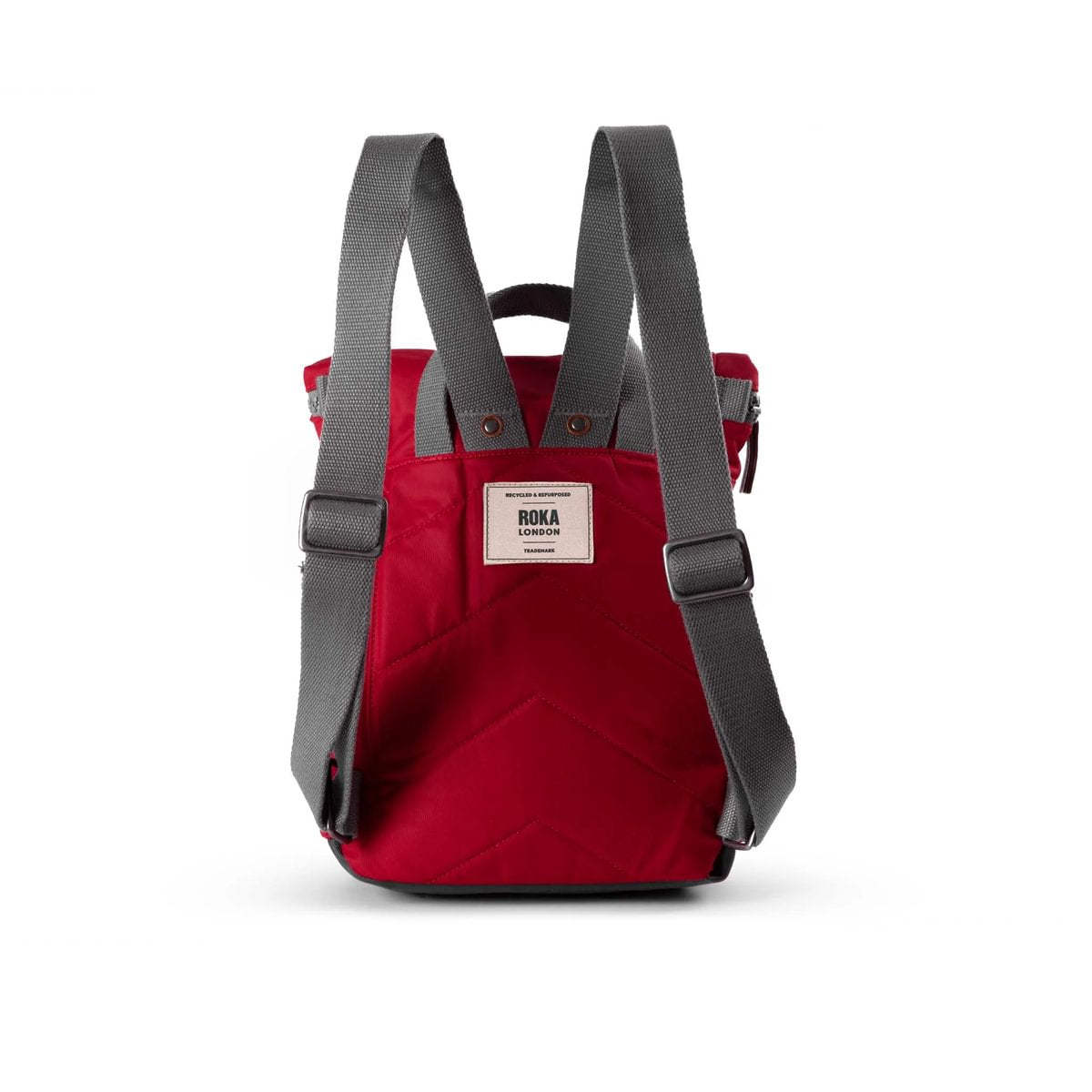 Red backpack with gray straps on a white background - view of back of product showing padded back and adjustable straps.