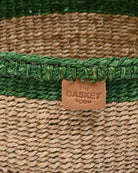 Close-up of a woven basket with a 'The Basket Room' label.