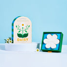 Skandi Blooms Daisy product packaging on a blue background