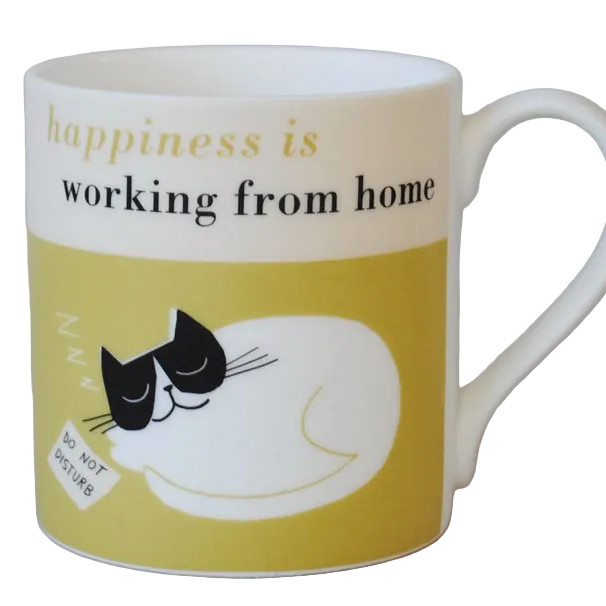 Mug with a cat illustration on a green background and text 'happiness is working from home' shown displayed on a grey background