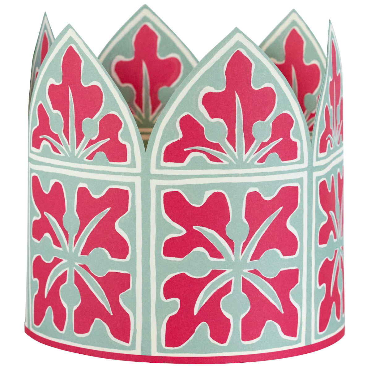 Decorative paper crown with pink and green floral pattern on a white background