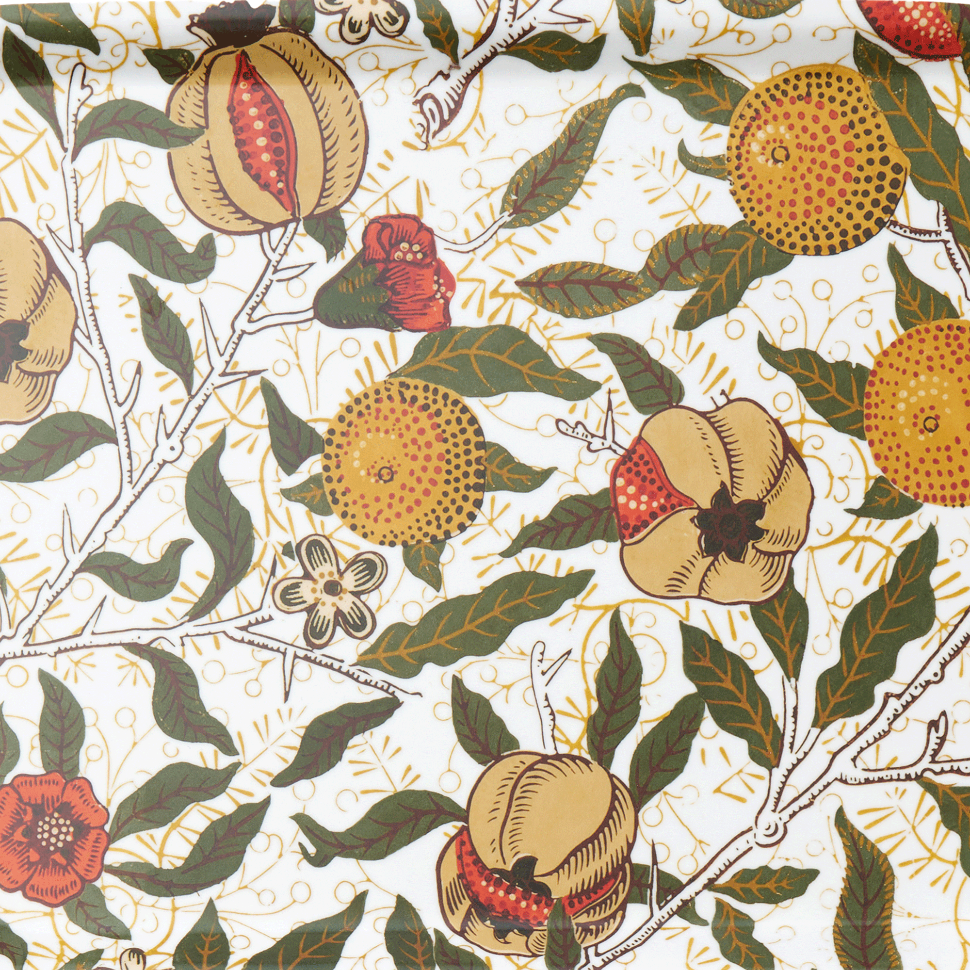 Patterned fabric with fruits, leaves, and flowers on a white background
