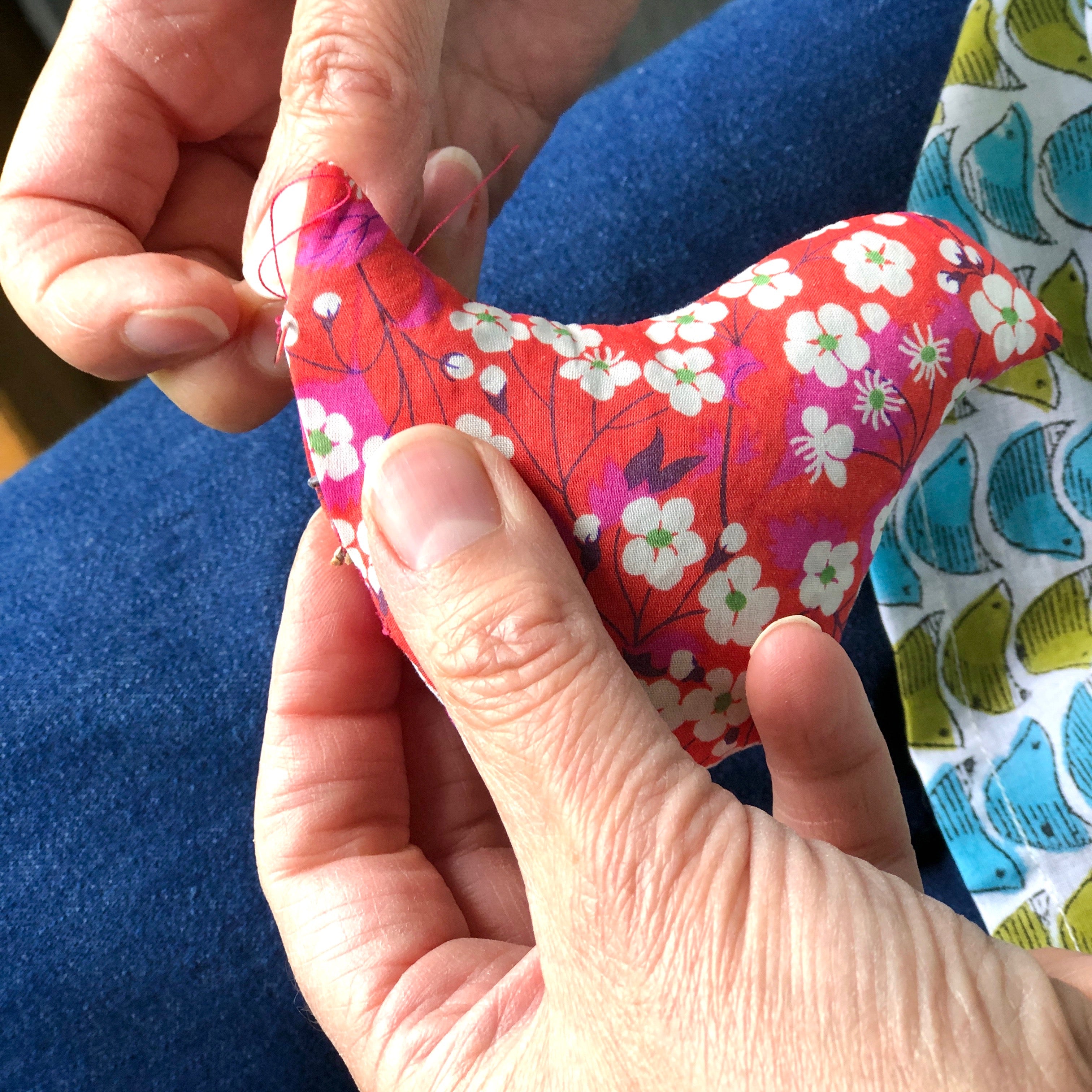 lavender bird being sewn