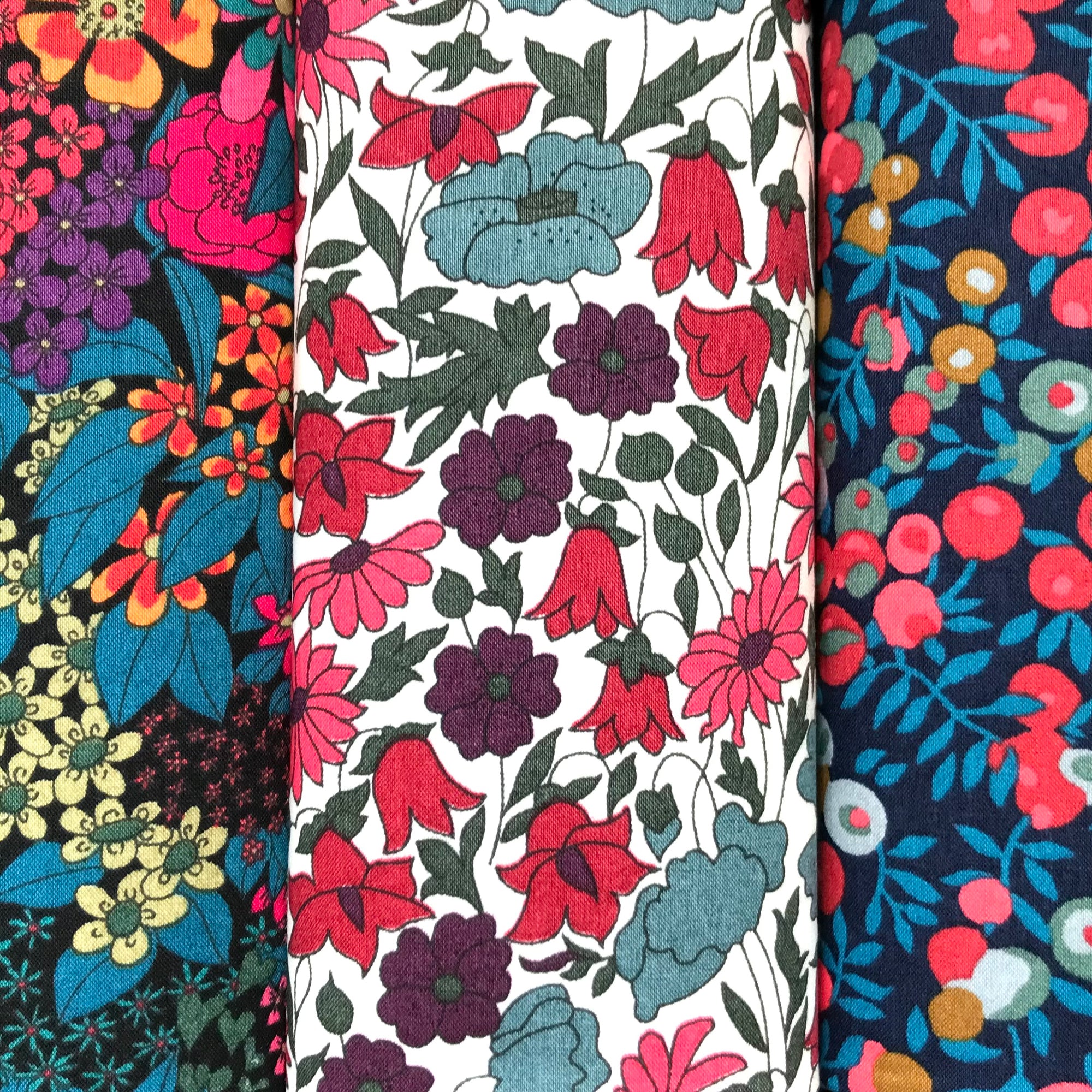 Dark blue and pink floral cotton hankies with vibrant colours and patterns.