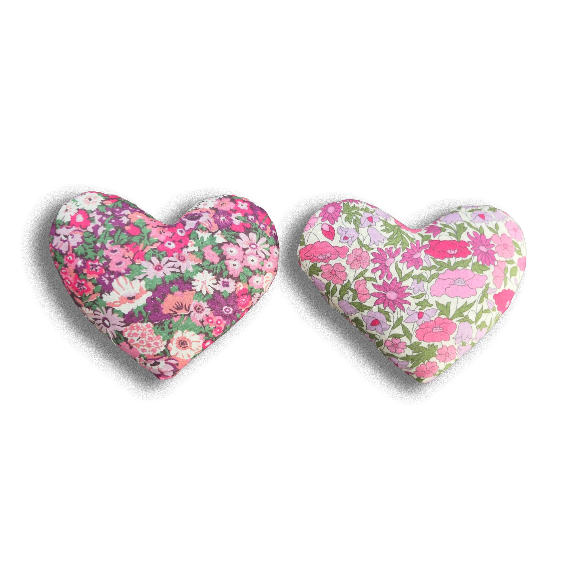 Two lavender hearts in Liberty prints in pink on a white background