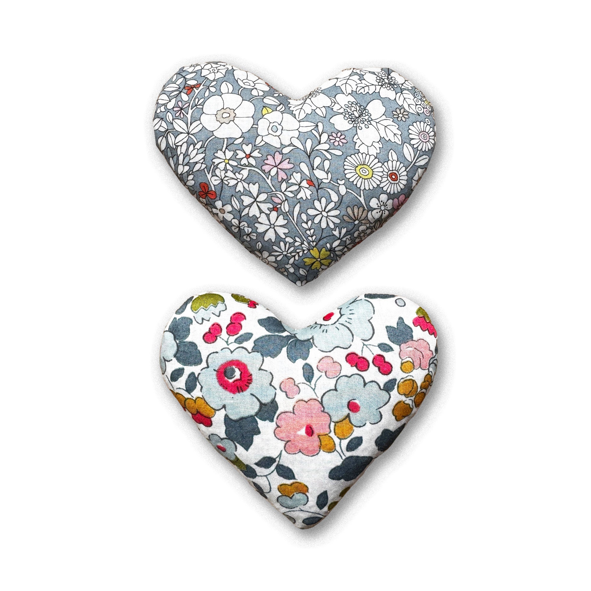 Two heart-shaped lavender bags in grey with floral patterns on a white background