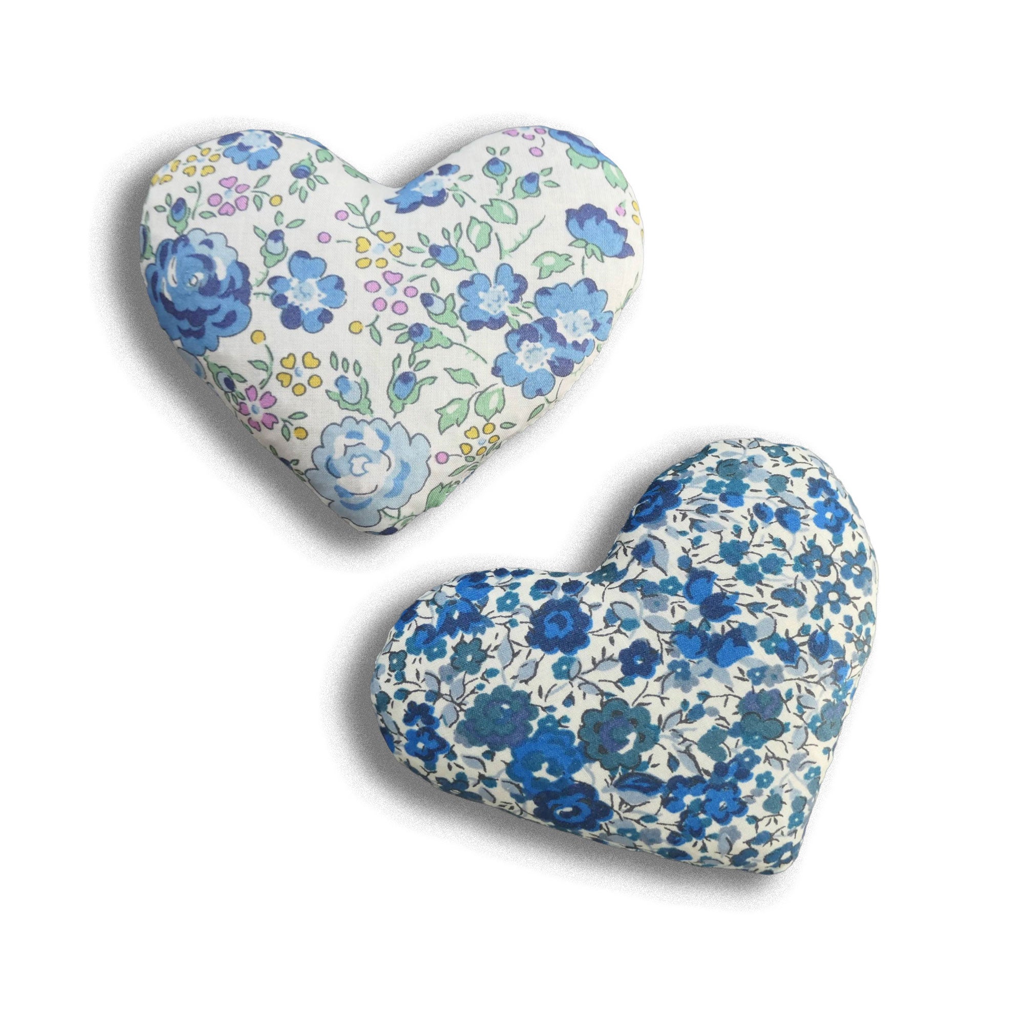 Two heart-shaped cotton lavender bags with floral patterns on a white background