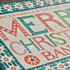 Decorative Christmas card with colorful text and patterns