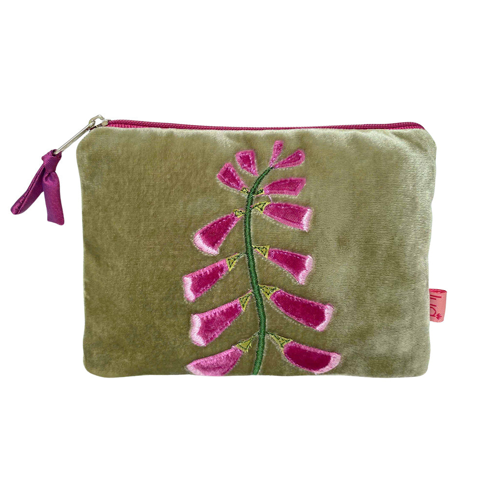 Green pouch with pink floral design on a white background