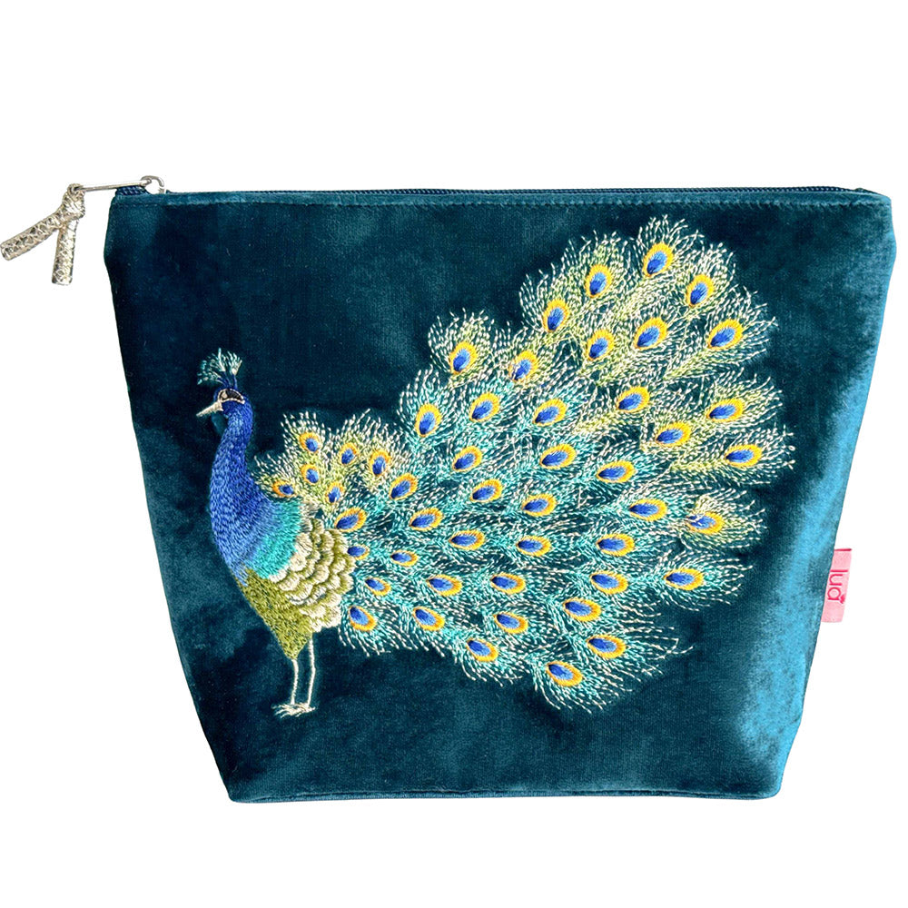 Blue pouch with a peacock design on a white background