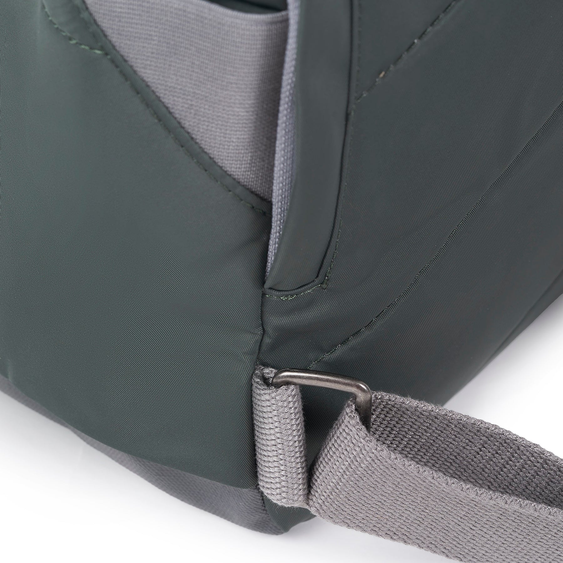 Close-up of a green bag with a strap on a white background