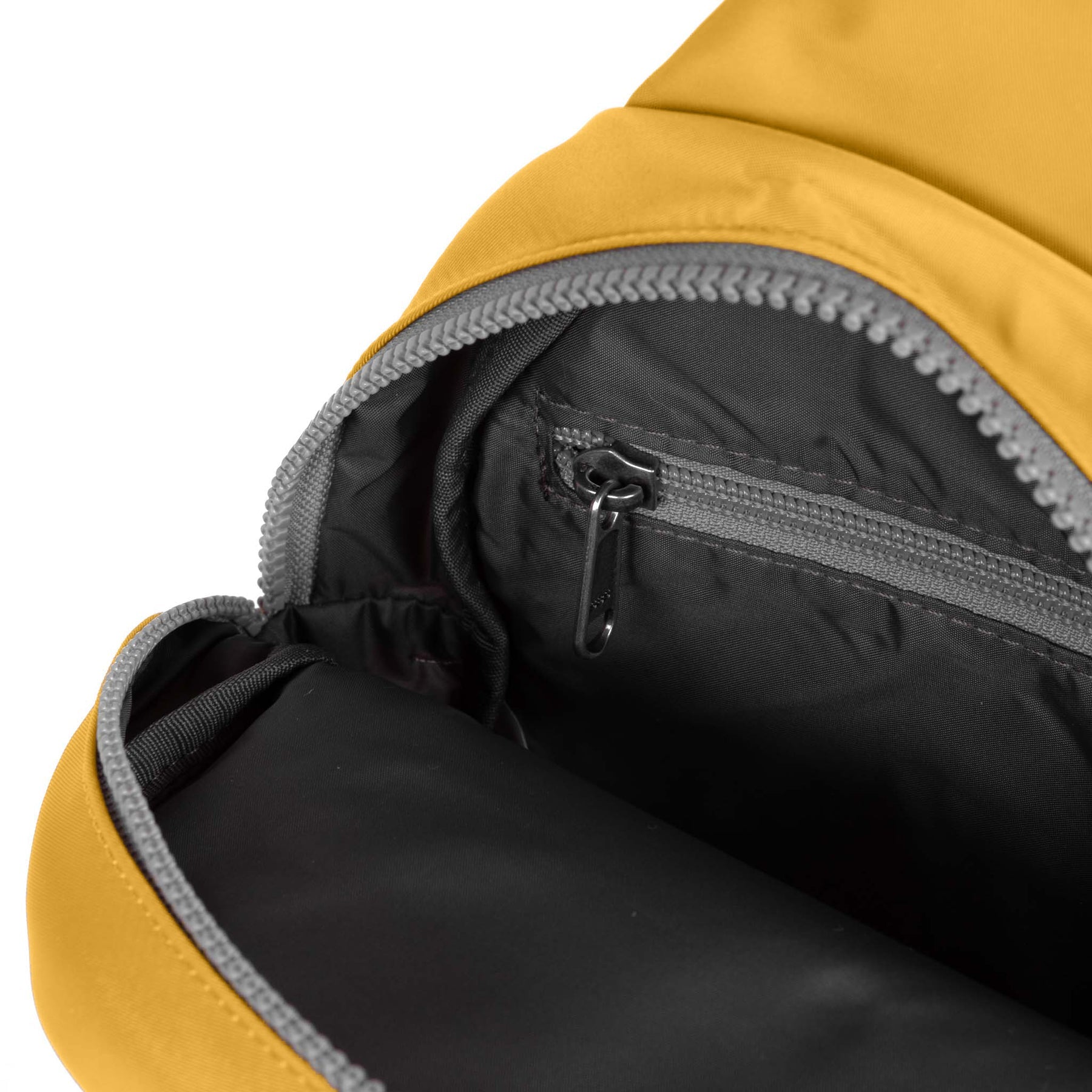 Close-up of a yellow and black backpack with a zipper