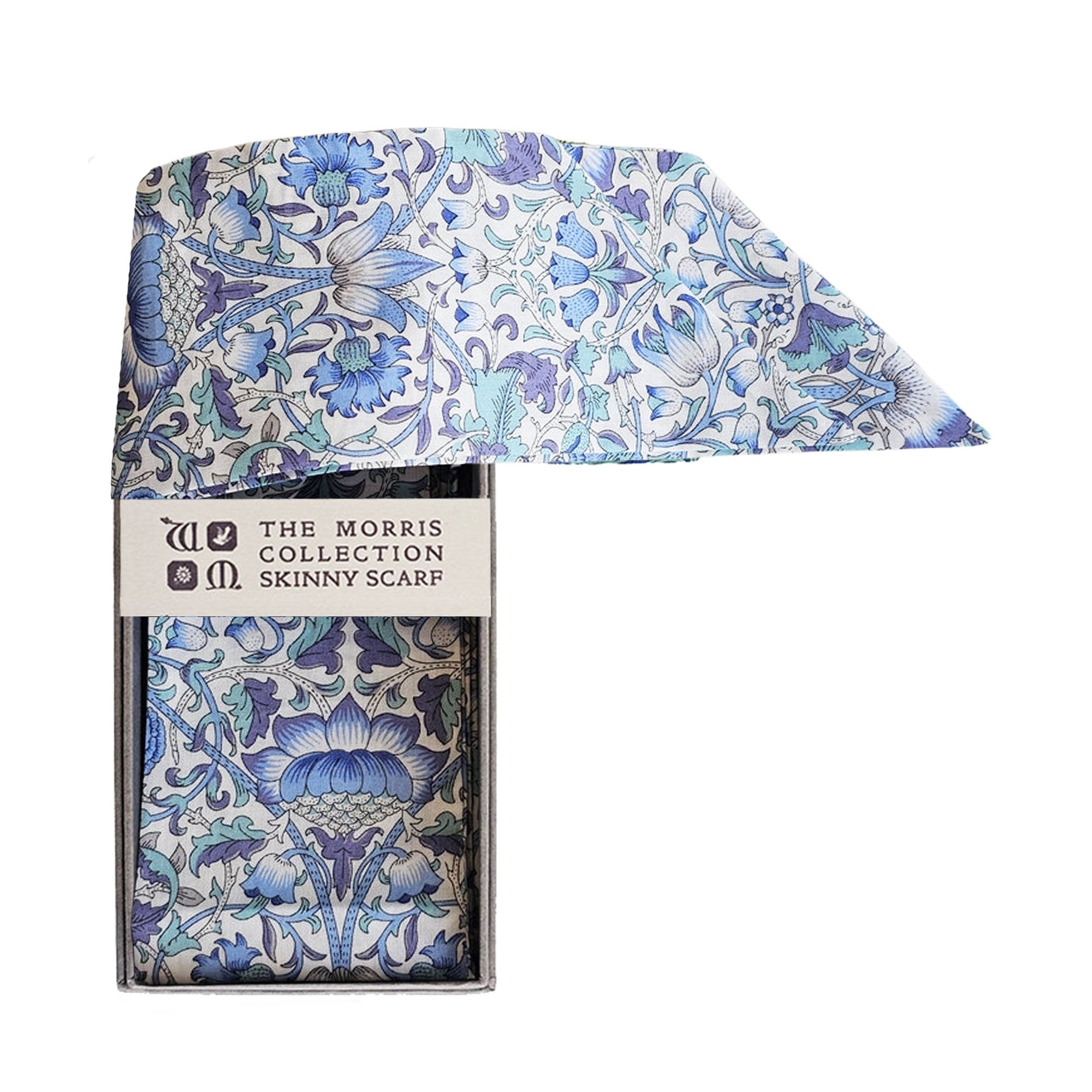 Blue and white botanical print scarf trailing out of a grey presentation box with “The Morris Collection” branding