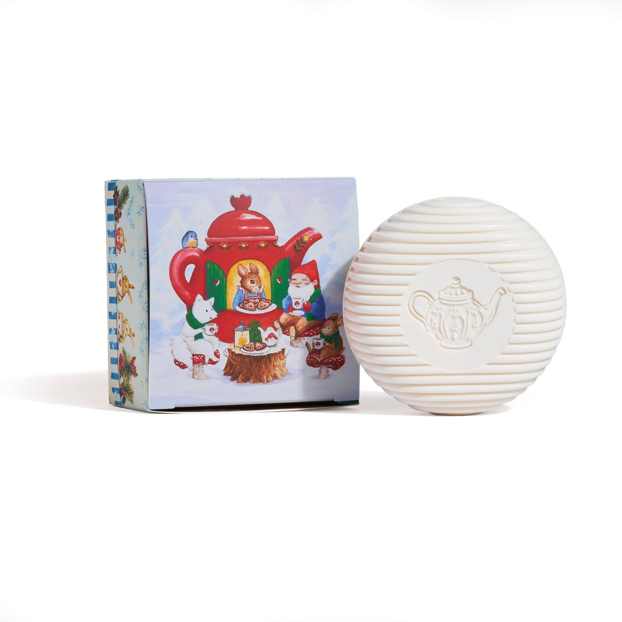 White spherical soap with teapot design next to a colourful box on a white background