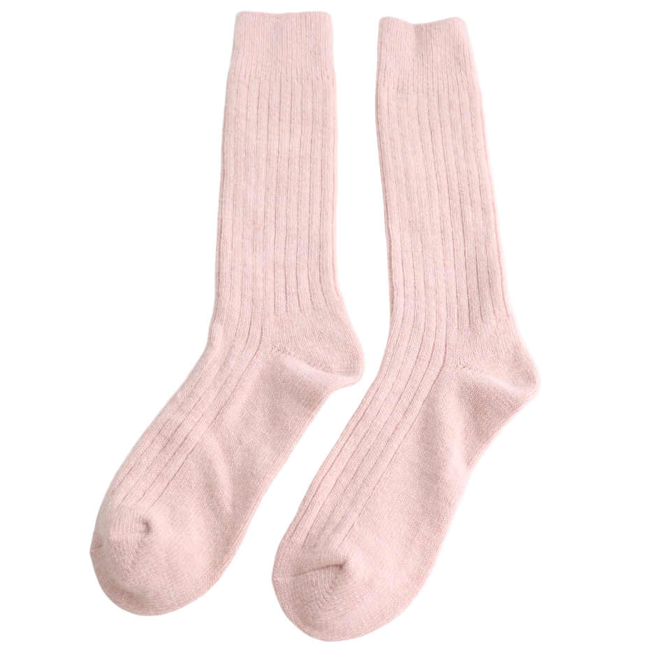 Pair of pink socks on a light gray background