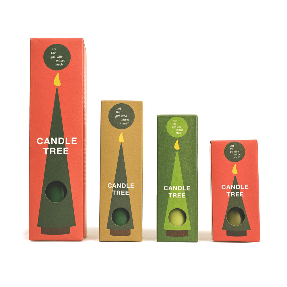 Four boxes of Candle Tree products on a white background