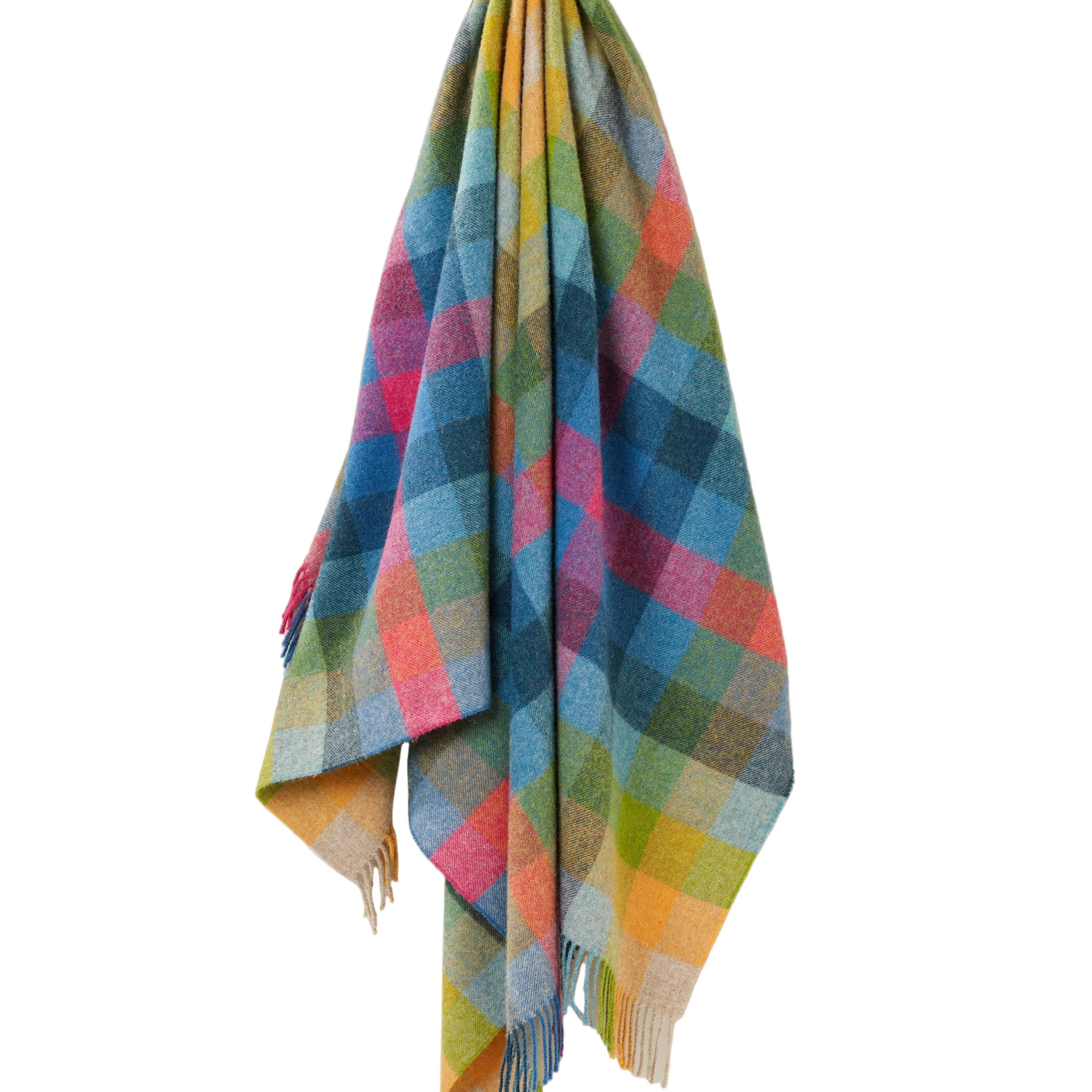 Multicoloured plaid blanket draped on a white background