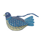 Decorative blue and beige bird ornament on a white background
