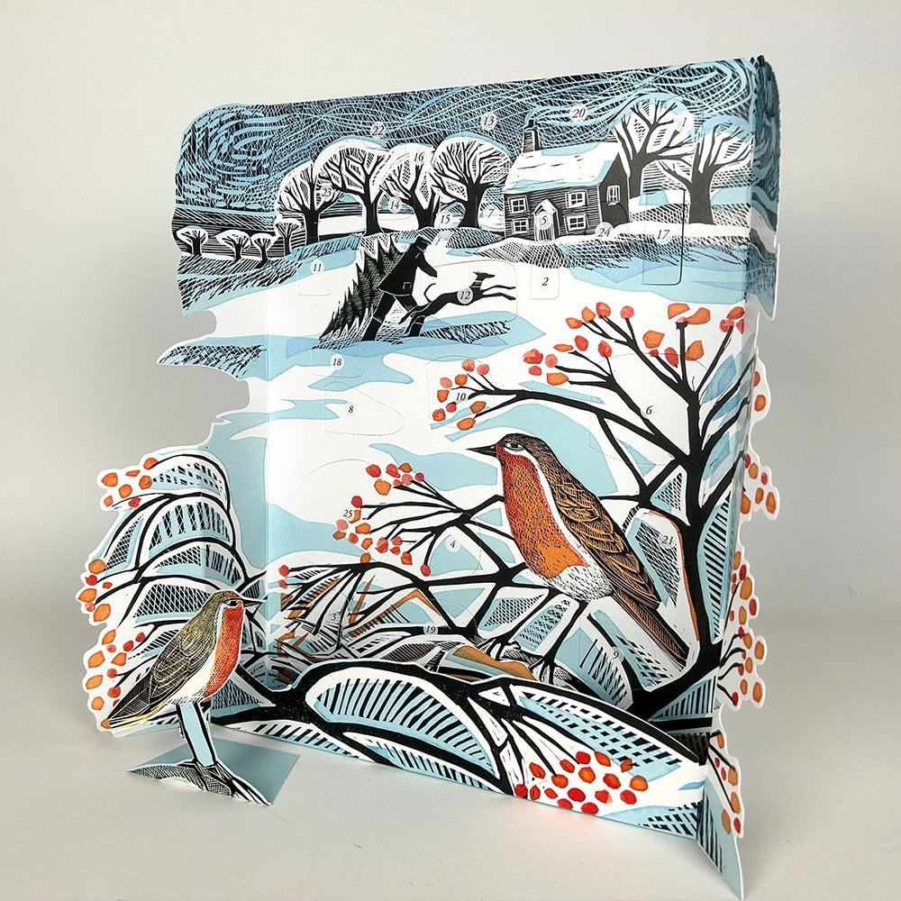 Packaged product with winter scene design featuring birds and trees on a white background
