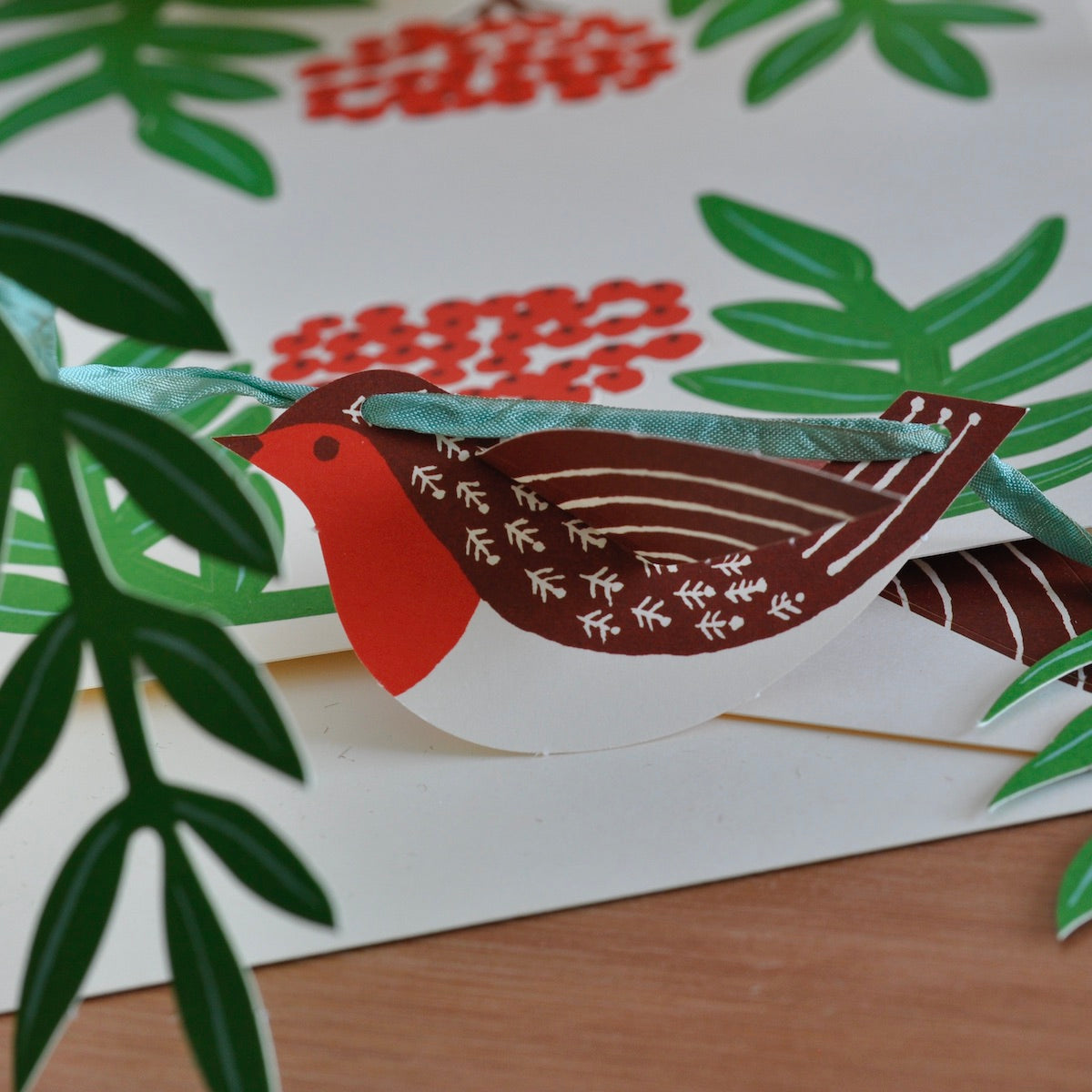 Card with a robin design on a floral background