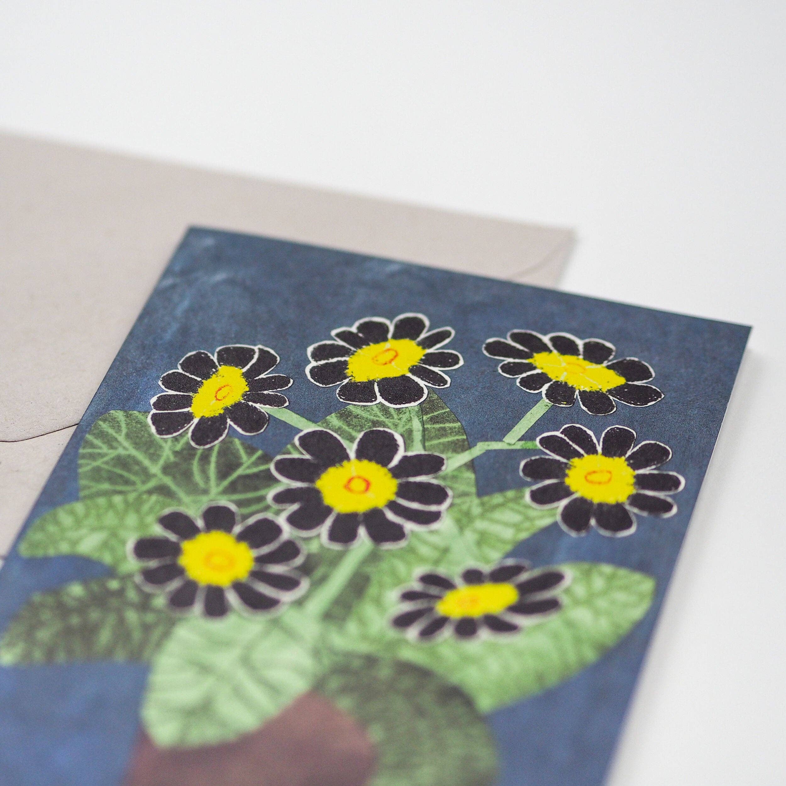 Greeting card with floral design on a blue background