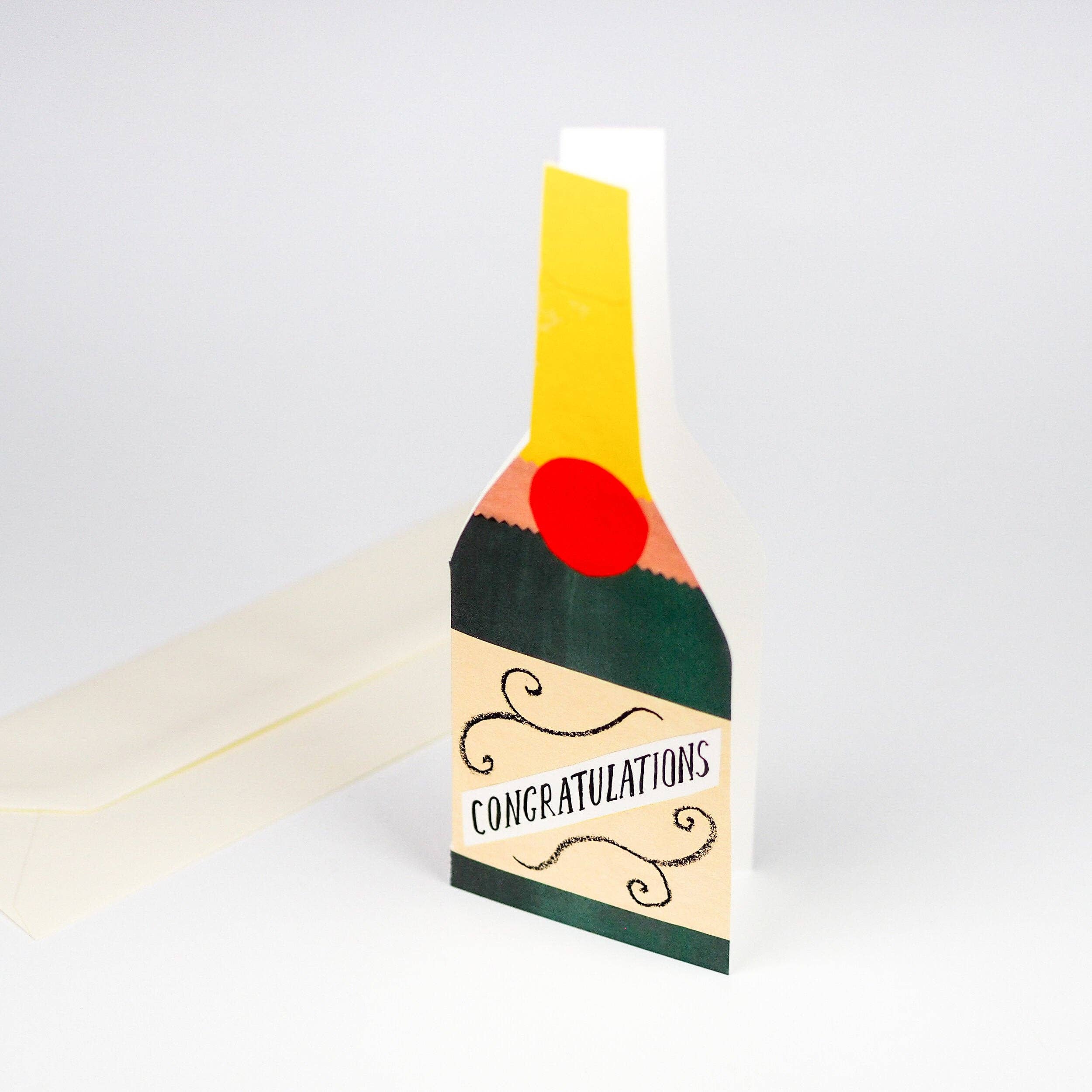 Card designed like a champagne bottle with 'Congratulations' text on a white background