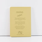 Beige notebook with text and branding on a white background