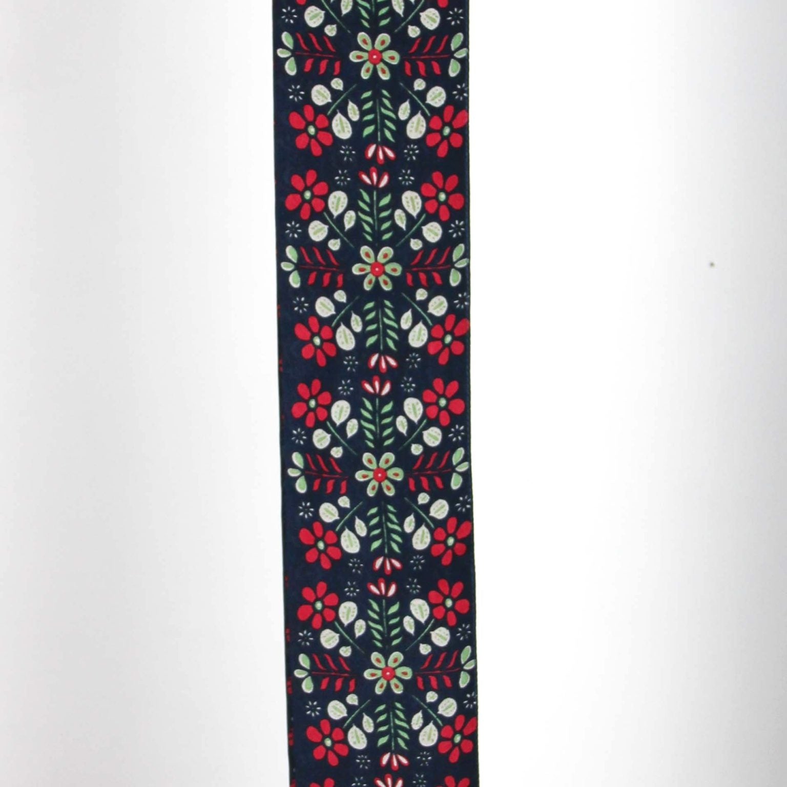 Floral patterned fabric strip on a white background
