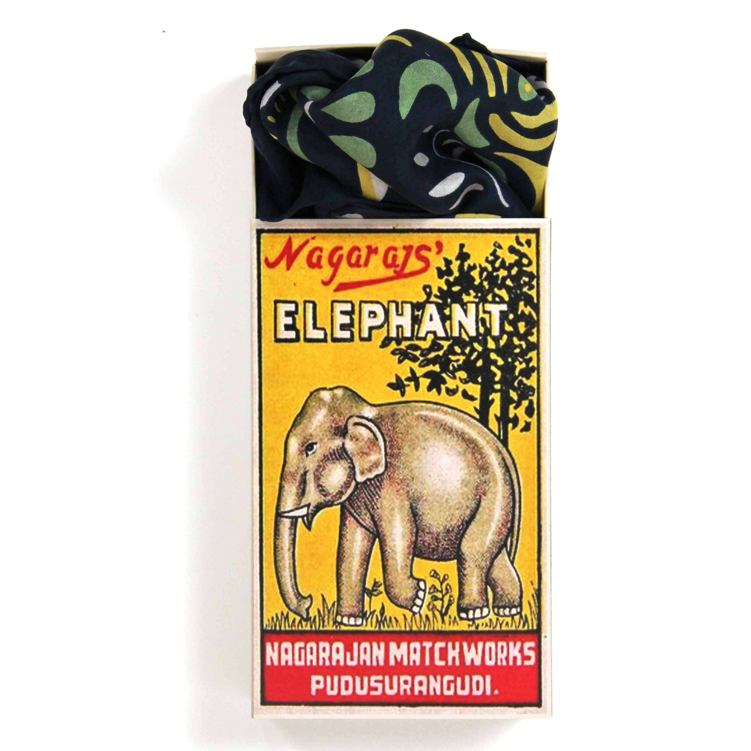 Matchbox with elephant design and 'Nagaraj's Elephant' branding on a white background
