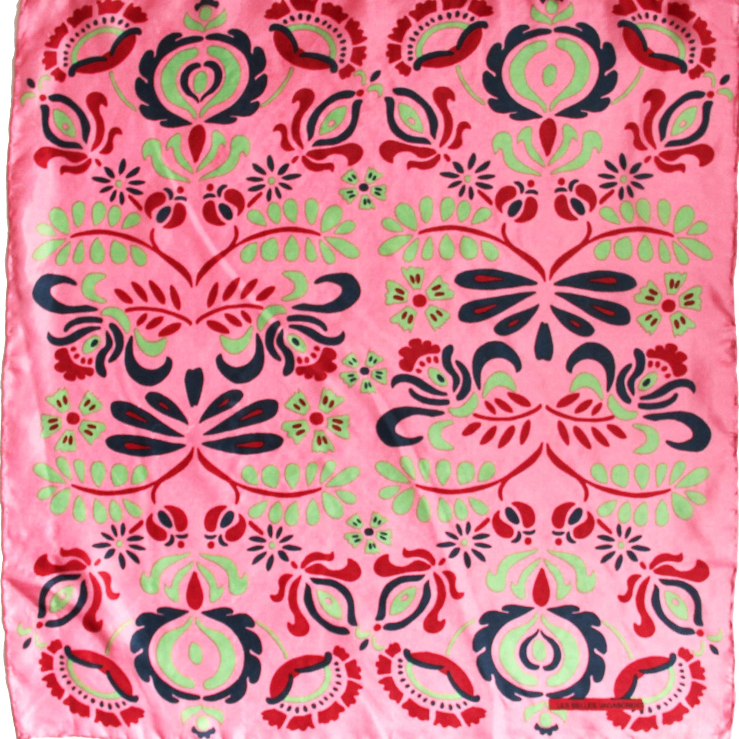 Pink fabric with black, green, and red floral pattern