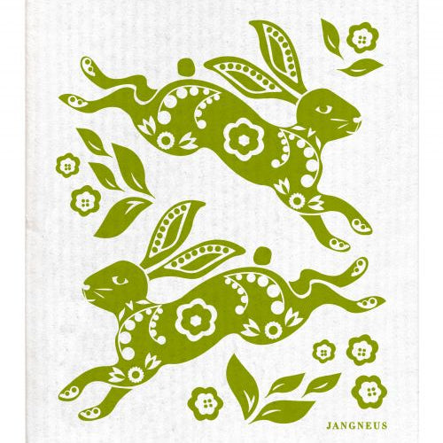 Green rabbits with floral patterns on a white cloth, featuring the brand 'Jangneus'.