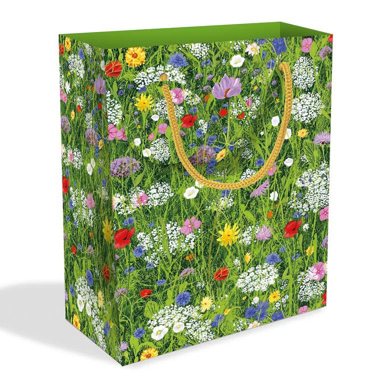 Short rectangular gift bag with white, red, pink, purple and yellow flowers in a green field
