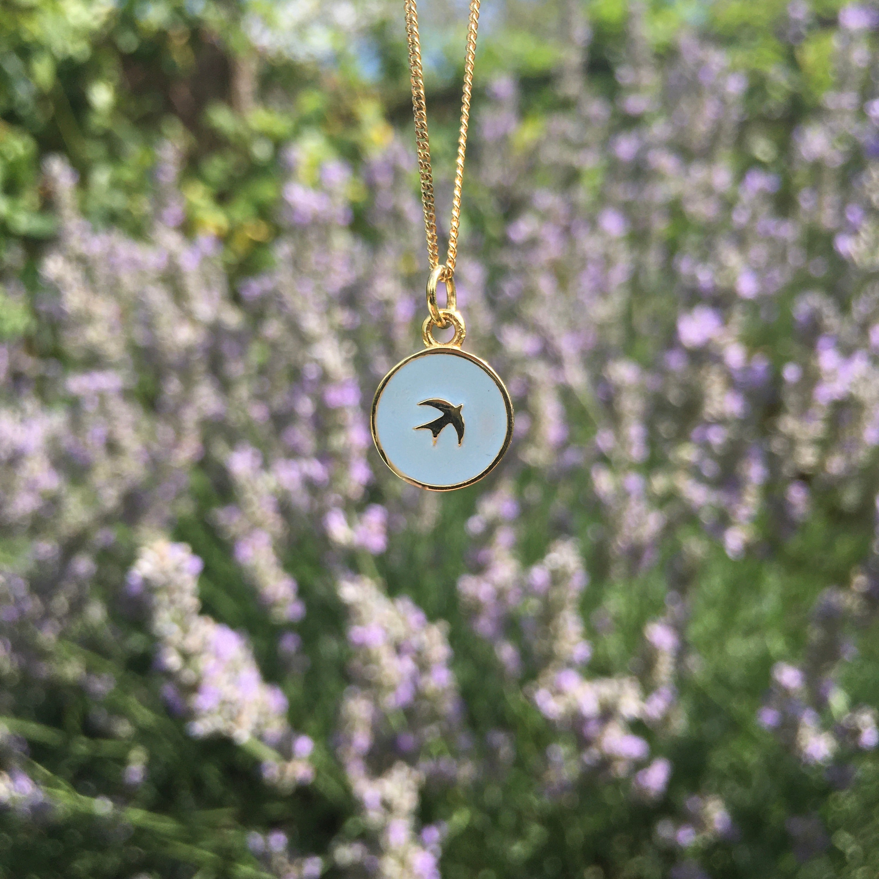 Swallow necklace with lavender behind