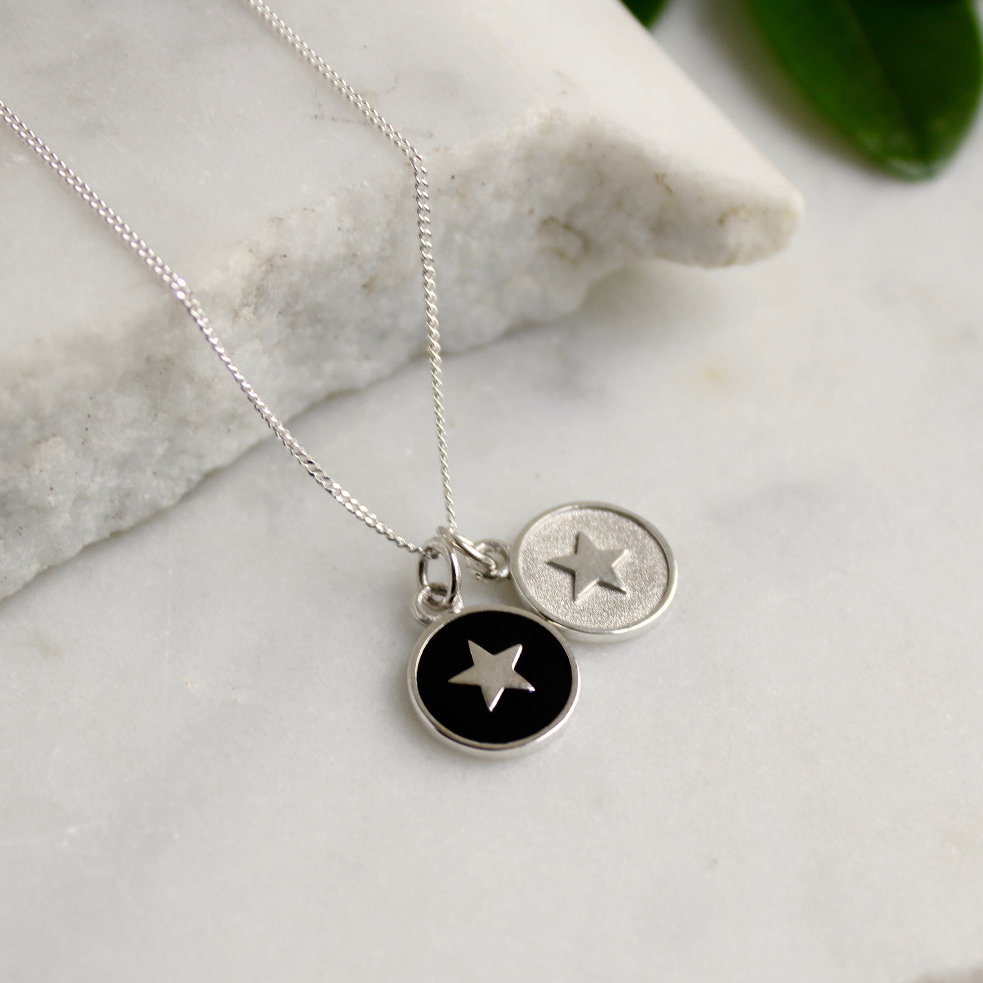 black enamel star with silver insert star