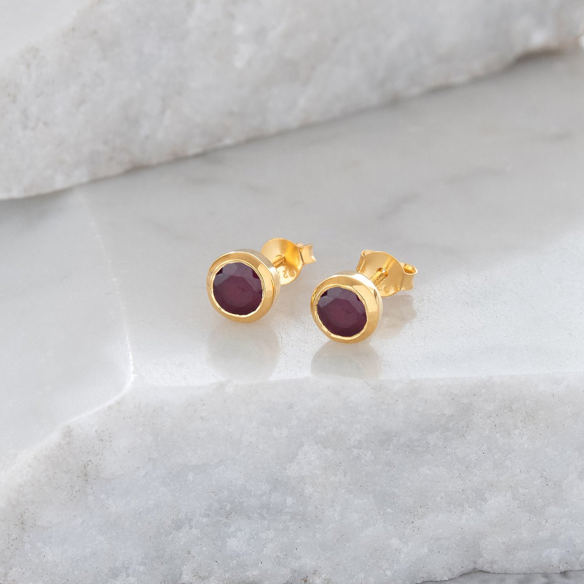 Gold stud earrings discount with ruby stone