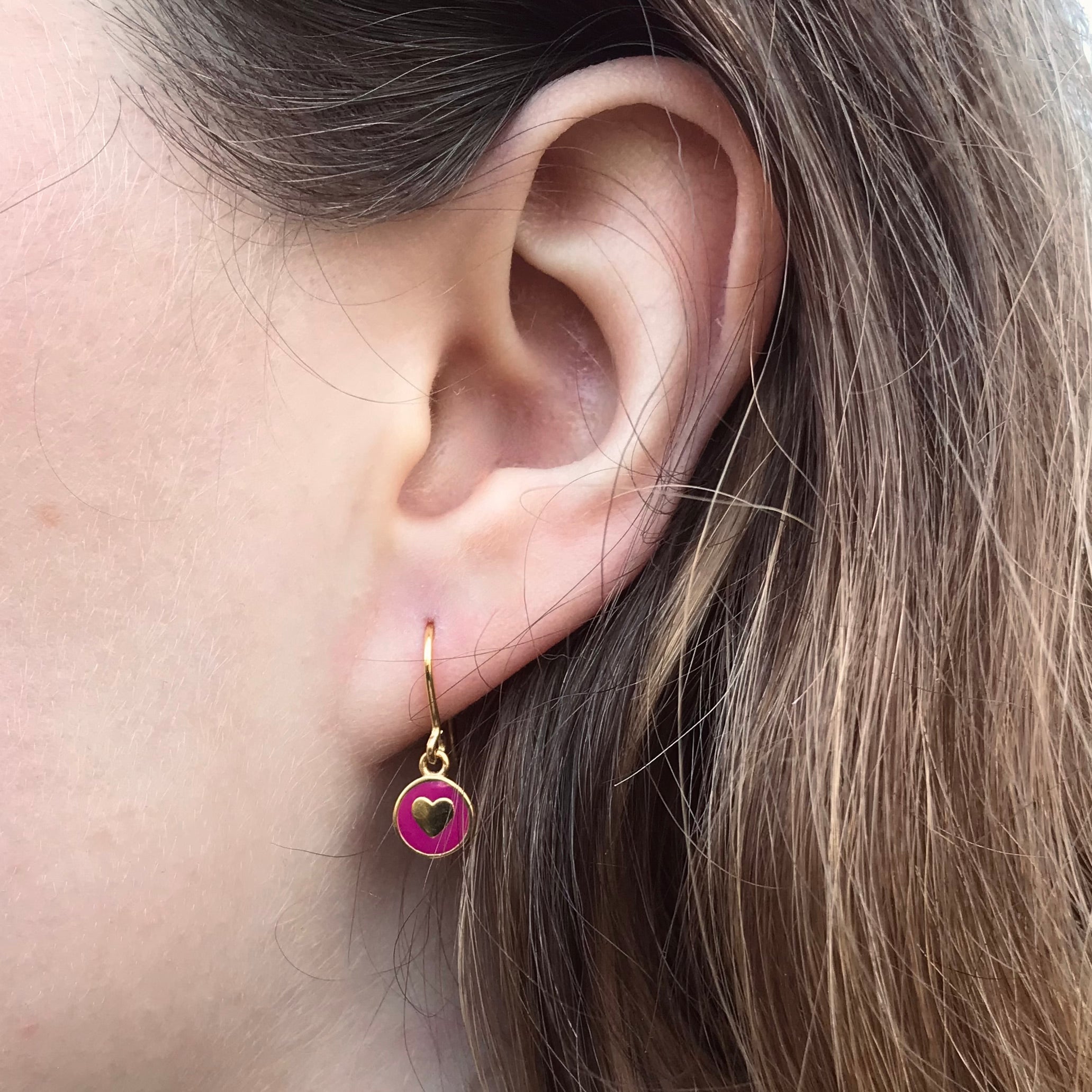 cherry heart earring in ear