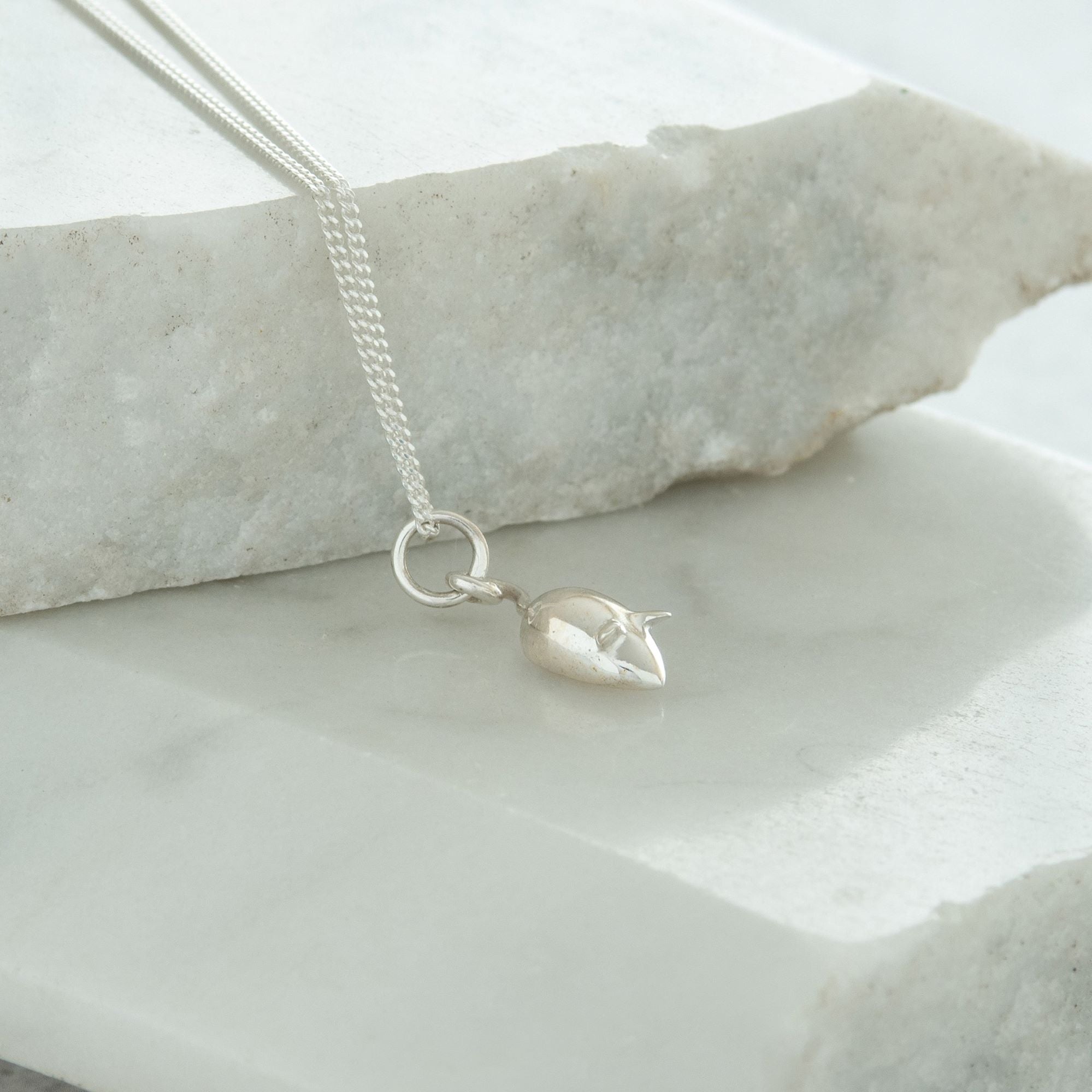 tiny mouse pendant close up