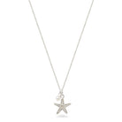 starfish and pearl necklace on white background