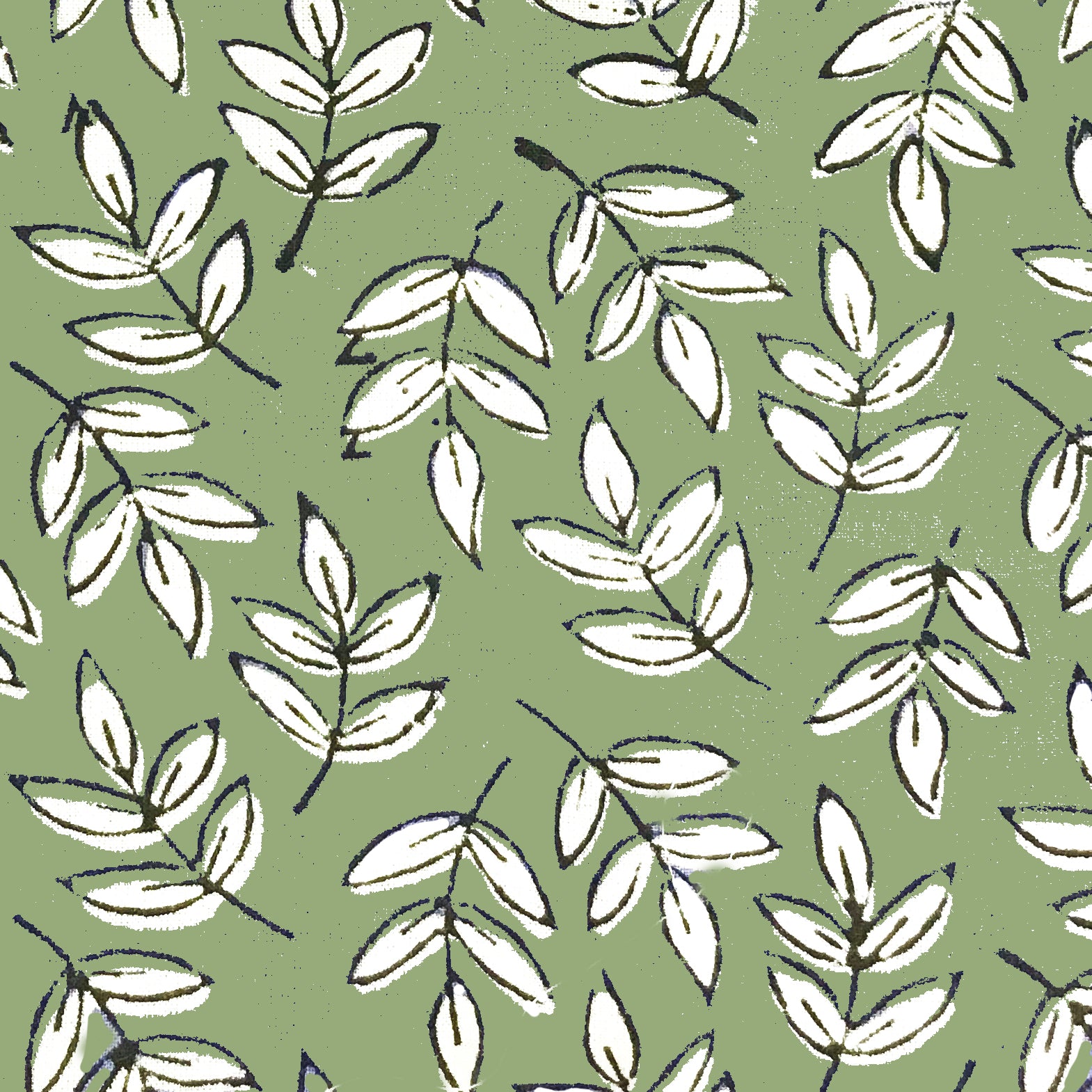 block print fabric close up of green leaf design