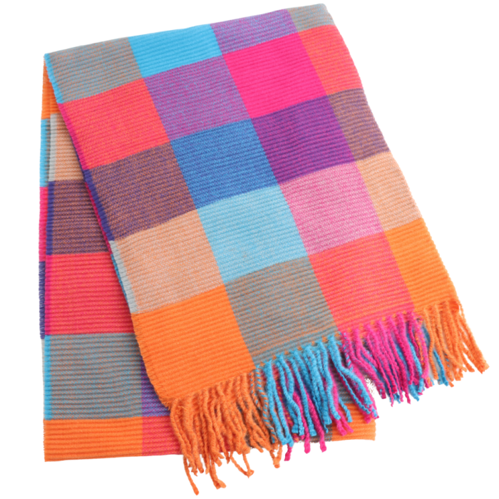 A folded woven throw blanket with a colorful plaid pattern and fringe tassels, shown on a plain white background.