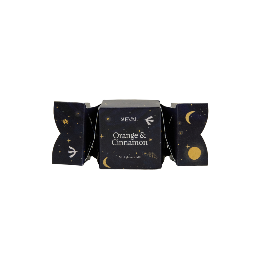 Sheval Orange & Cinnamon mini glass candle packaging on a light gray background