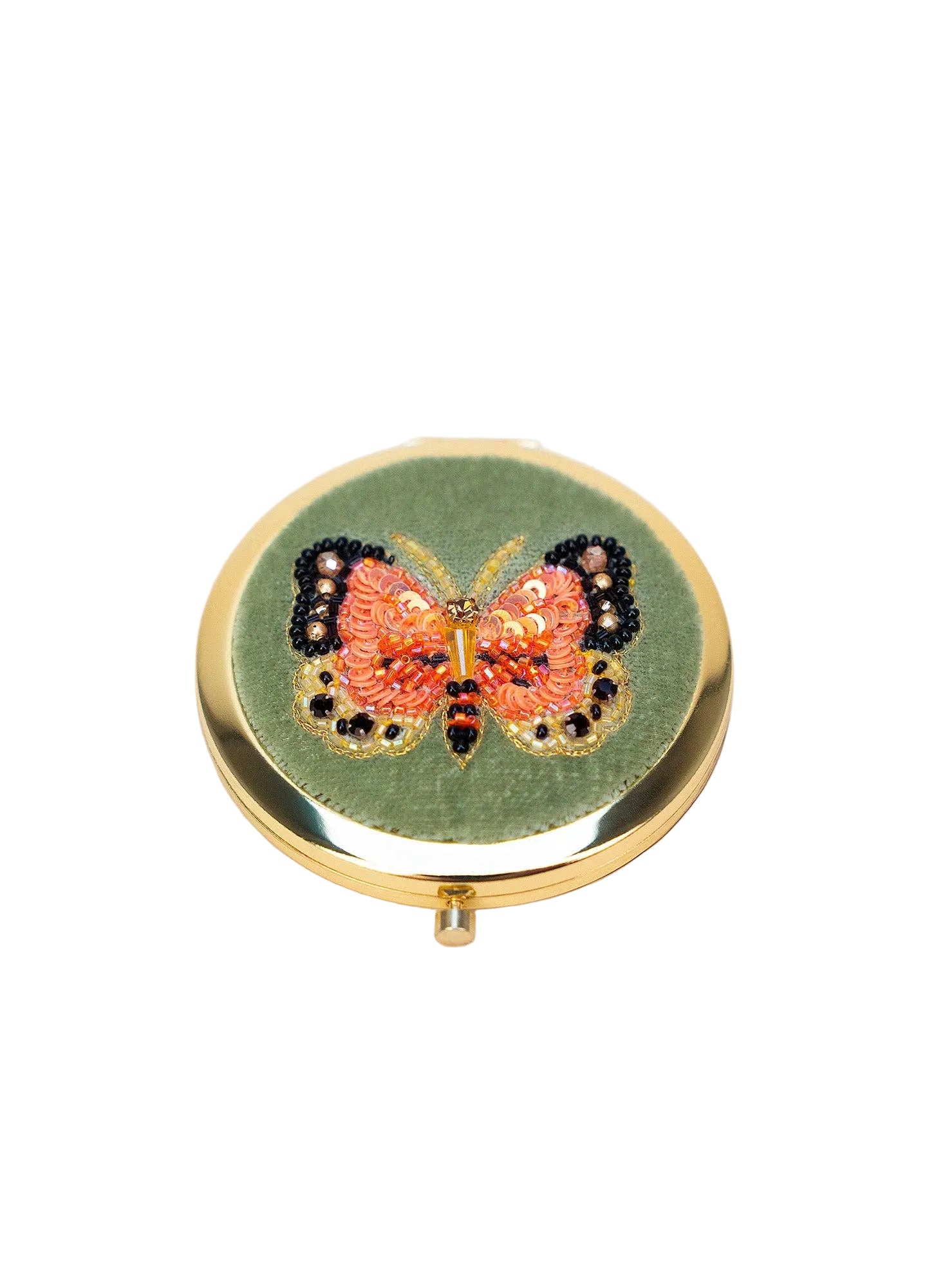 Compact mirror with butterfly design on a white background