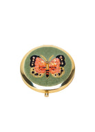 Compact mirror with butterfly design on a white background