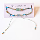 Gemstone and gold beaded bracelet on card with Calmness branding